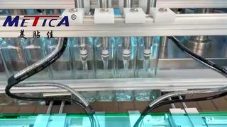 Tappatrice per riempimento di liquidi per bottiglie di vetro